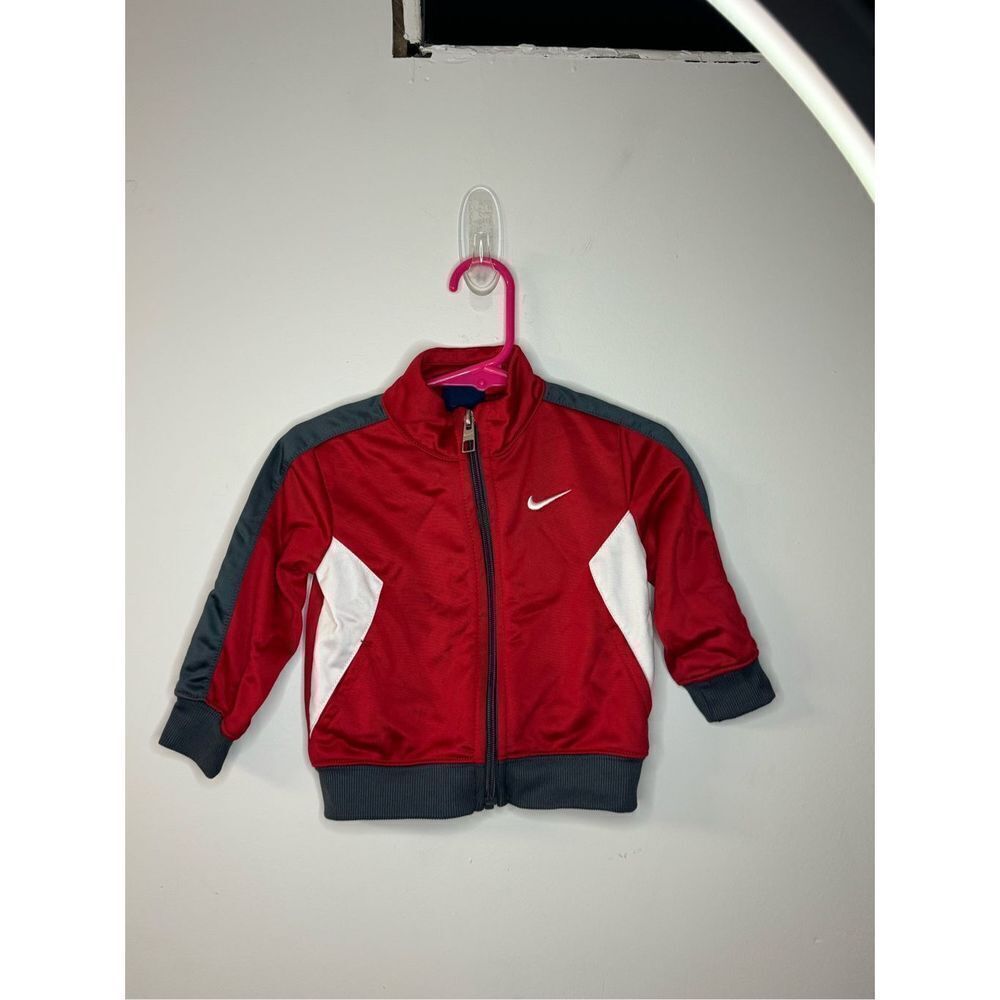 Red and white children’s Nike jacket size 12 month